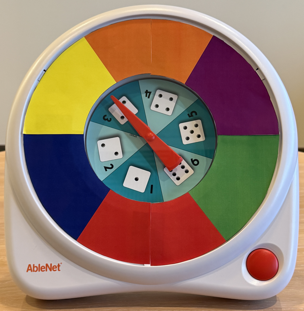 The AbleNet All-Turn-It Spinner with a six-color,  blue, green, red, purple, orange, and yellow, overlay.