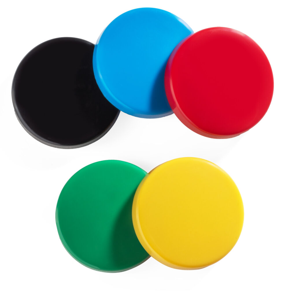 Five interchangeable Specs IC switch tops in black, blue, red, green, and yellow