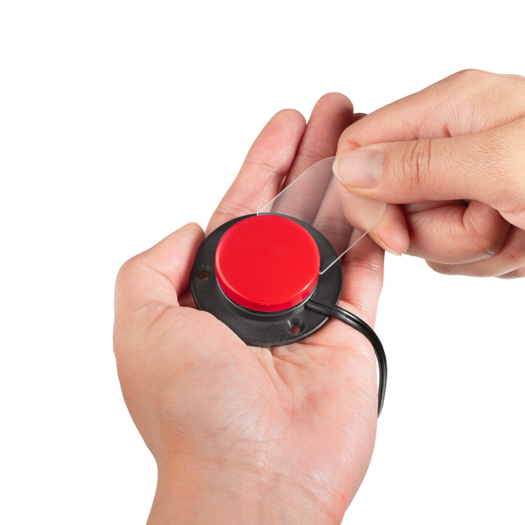 Person using release tool on Specs IC tab while rotating red switch cap
