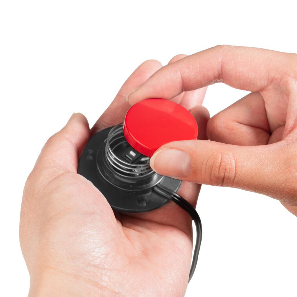 Person changing interchangeable switch top on Specs IC adaptive switch