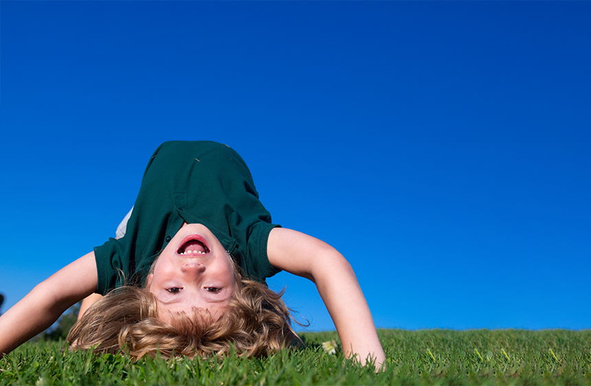 happy boy doing a backbend