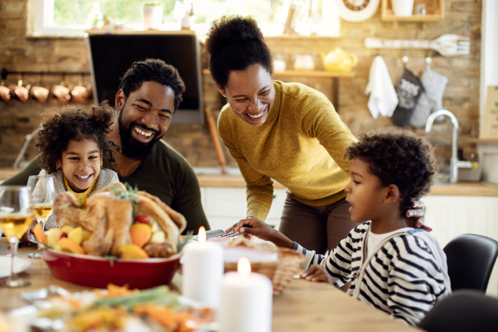 Family Enjoying A Thanksgiving Meal