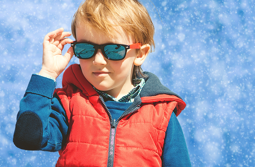 cool kid wearing sunglasses in the snow