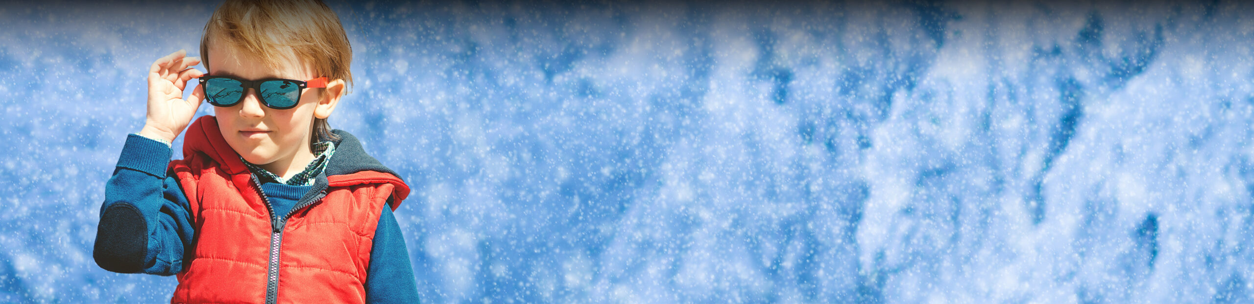 cool kid wearing sunglasses in the snow