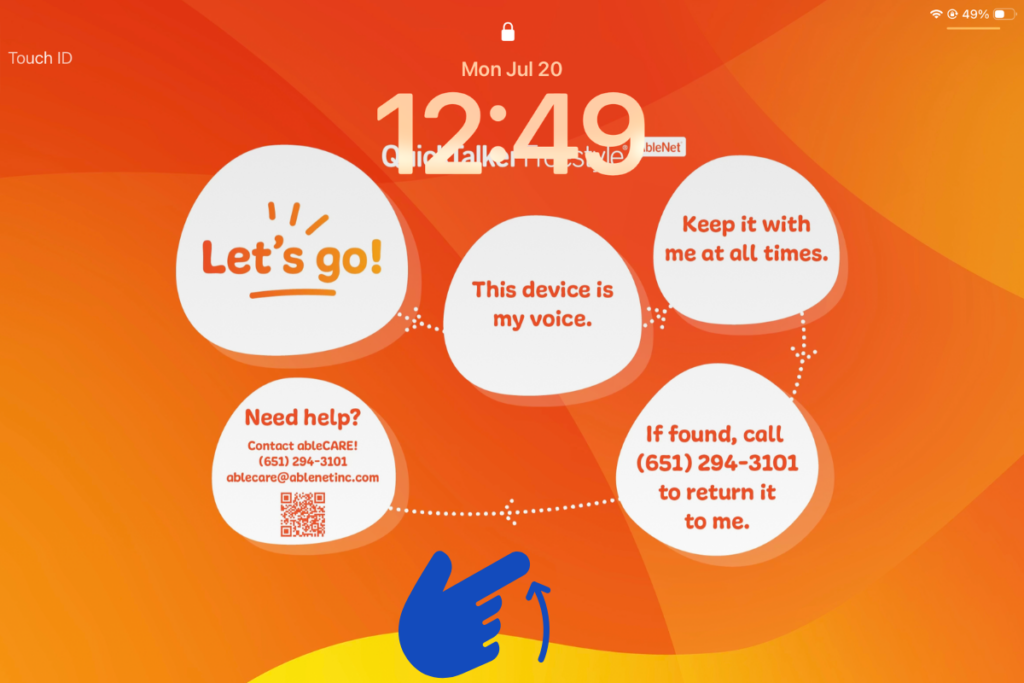 The lock screen of a QuickTalker Freestyle with a hand motion that swipes up from the bottom to unlock.